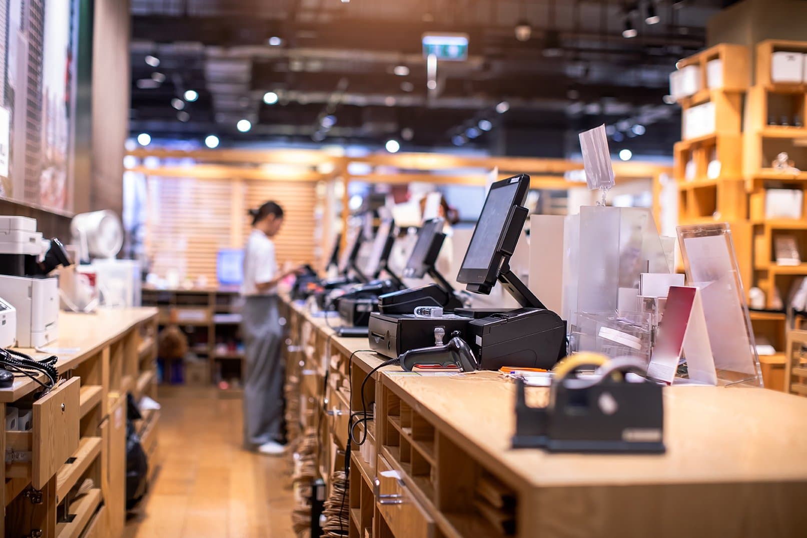 interior of a retail store view from the checkout counter with pos machines slightly unfocused