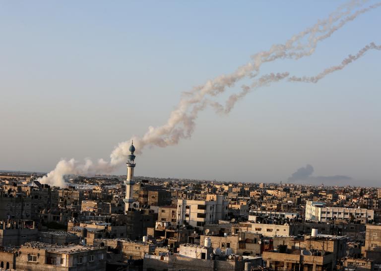 Gazan militants launch rockets from the Gaza Strip towards Israel.