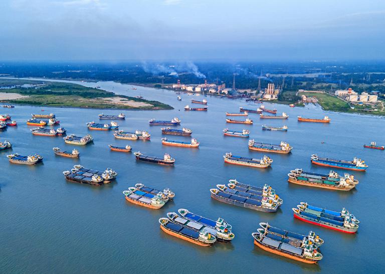 aerial view of cargo ships anchored near a port