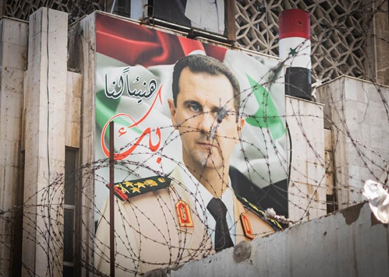 Poster with former Syrian President Bashar Al Assad on building facade