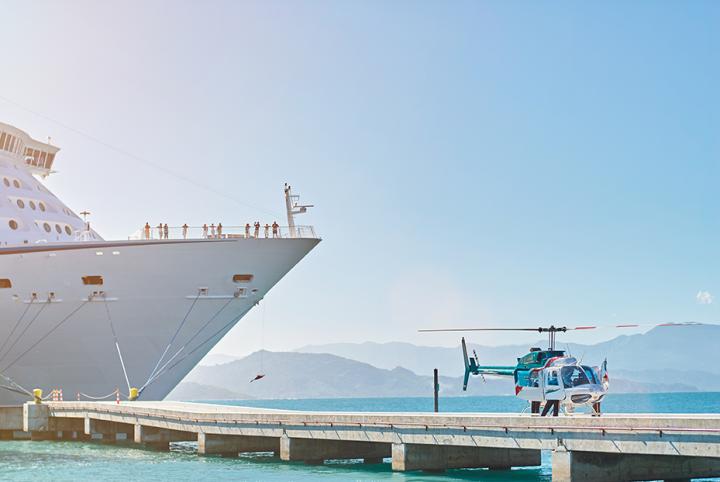 medevac from a cruise ship - medical helicopter departing or arriving on a dock from a moored cruise ship