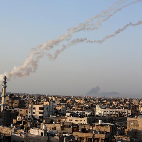 Gazan militants launch rockets from the Gaza Strip towards Israel.